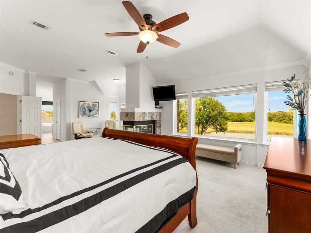 7436 Stoney Point Drive Plano, TX 75025 - Photo 20 of 40 a bed room with a bed and a large window