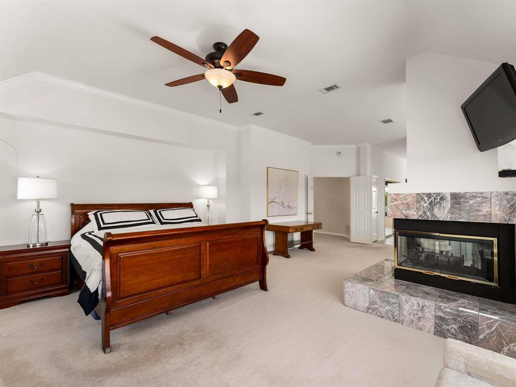 7436 Stoney Point Drive Plano, TX 75025 - Photo 21 of 40 a living room with furniture and a fireplace