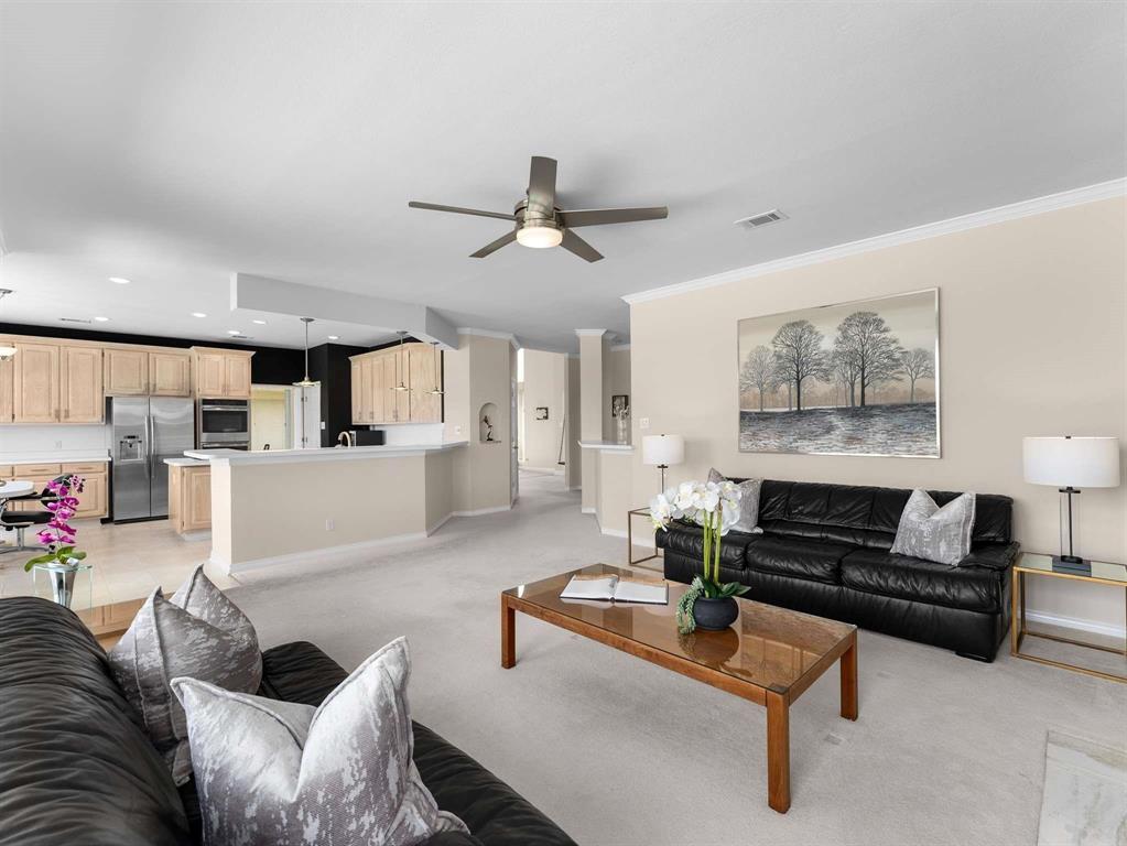 7436 Stoney Point Drive Plano, TX 75025 - Photo 27 of 40 a living room with furniture and kitchen view