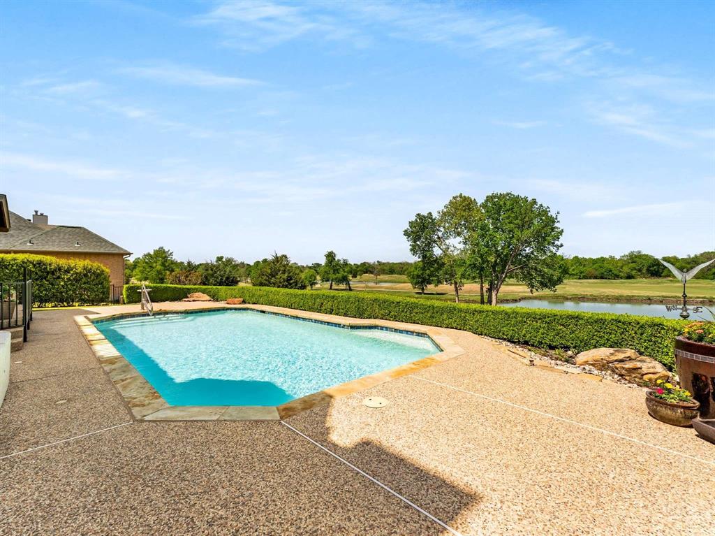 7436 Stoney Point Drive Plano, TX 75025 - Photo 7 of 40 an aerial view of a house with a swimming pool
