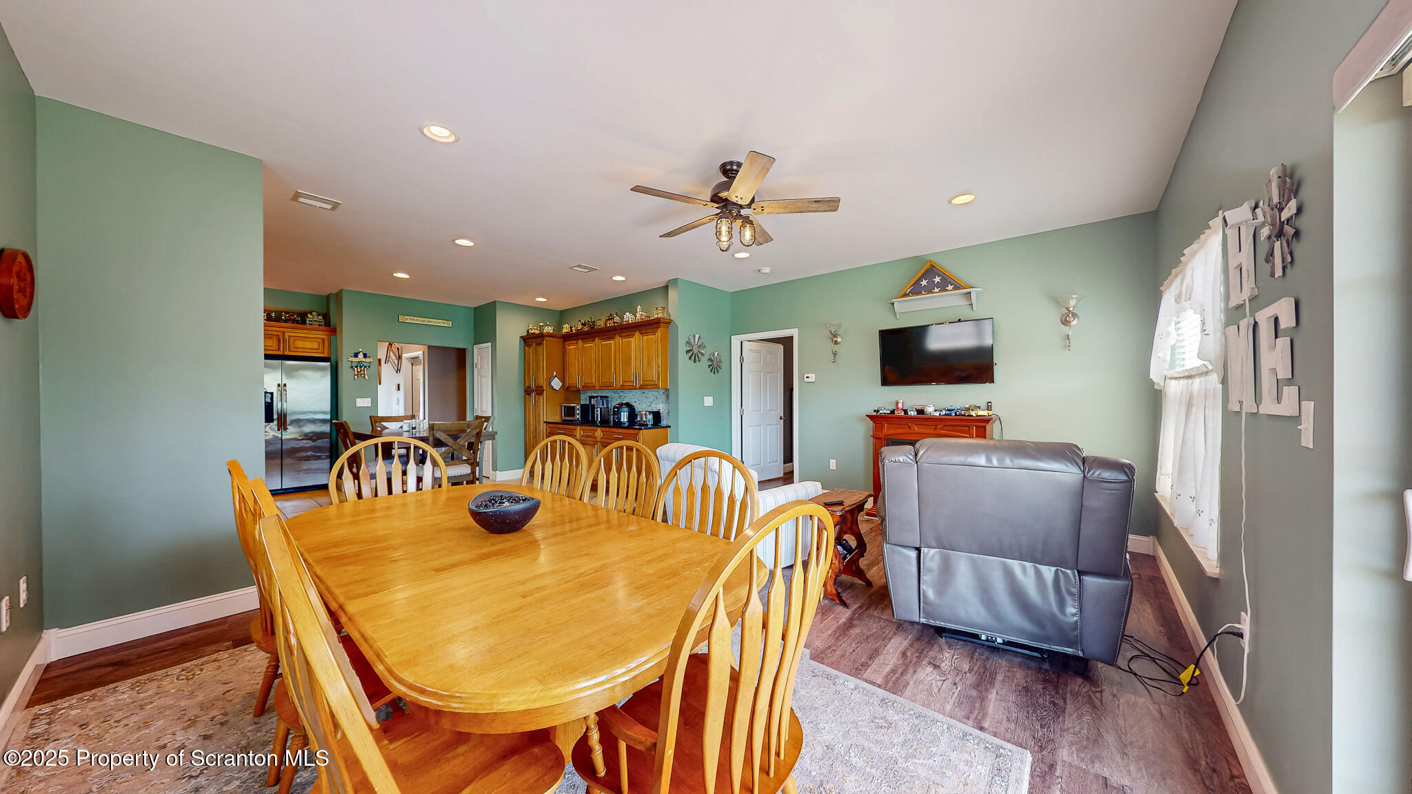 233 Shadow Wood Circle Archbald, PA 18403 - Photo 12 of 62 a dining room with furniture a chandelier and wooden floor