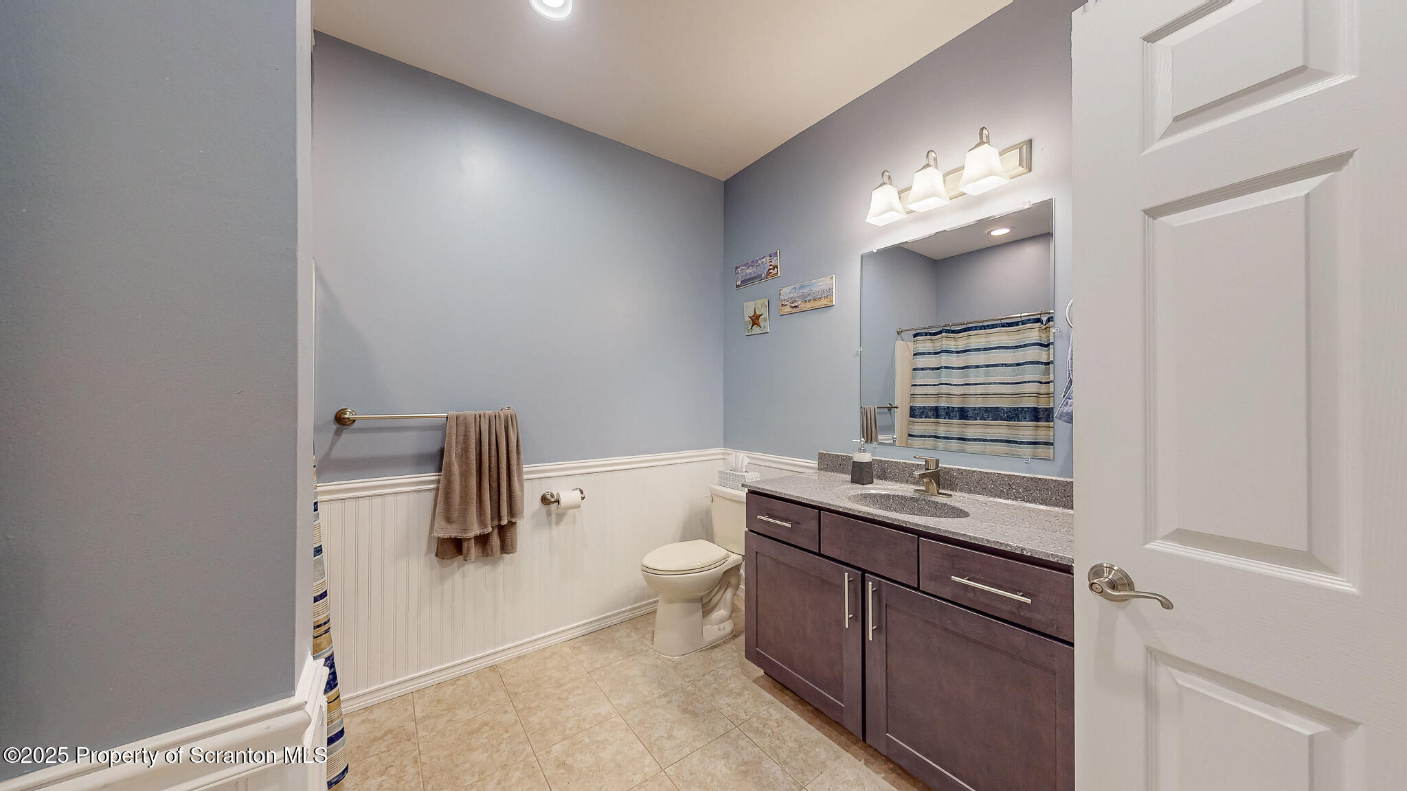 233 Shadow Wood Circle Archbald, PA 18403 - Photo 18 of 62 a bathroom with a granite countertop sink a toilet and a mirror