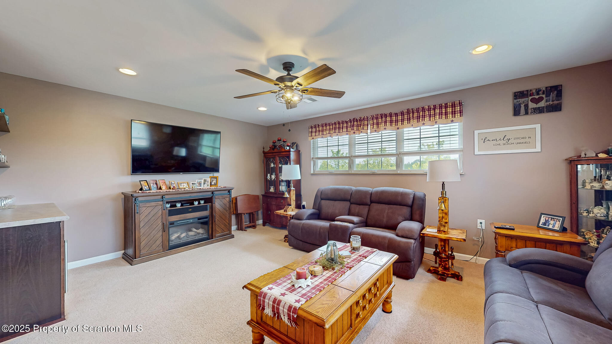 233 Shadow Wood Circle Archbald, PA 18403 - Photo 31 of 62 a living room with furniture and a flat screen tv