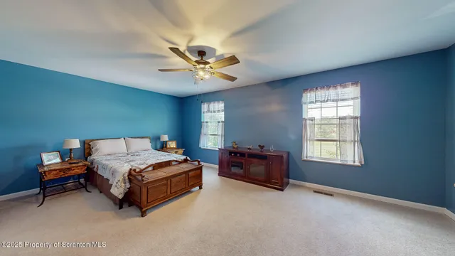 a front view of a house with a yard and a garage