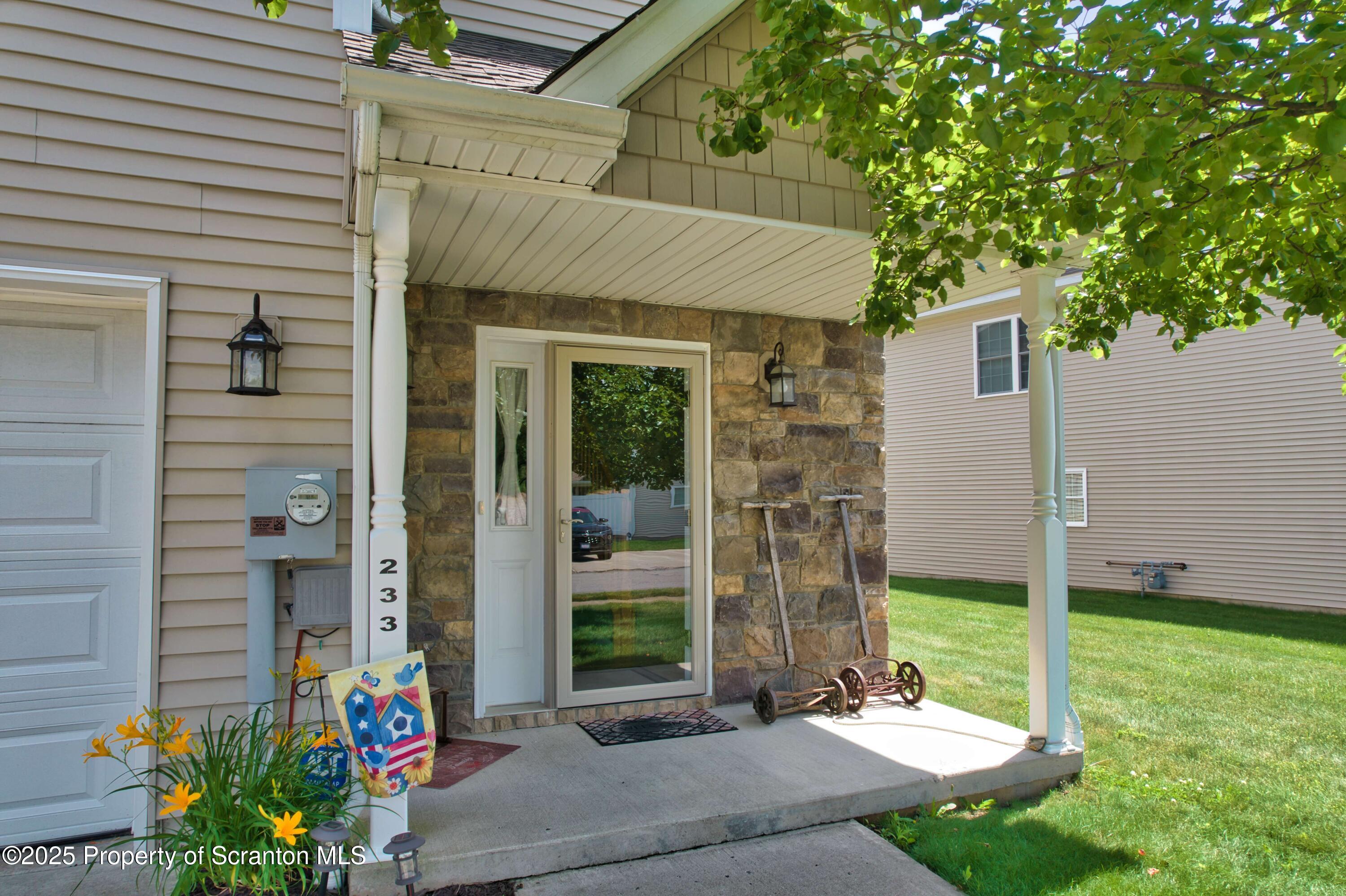 233 Shadow Wood Circle Archbald, PA 18403 - Photo 48 of 62 a front view of a house with garden
