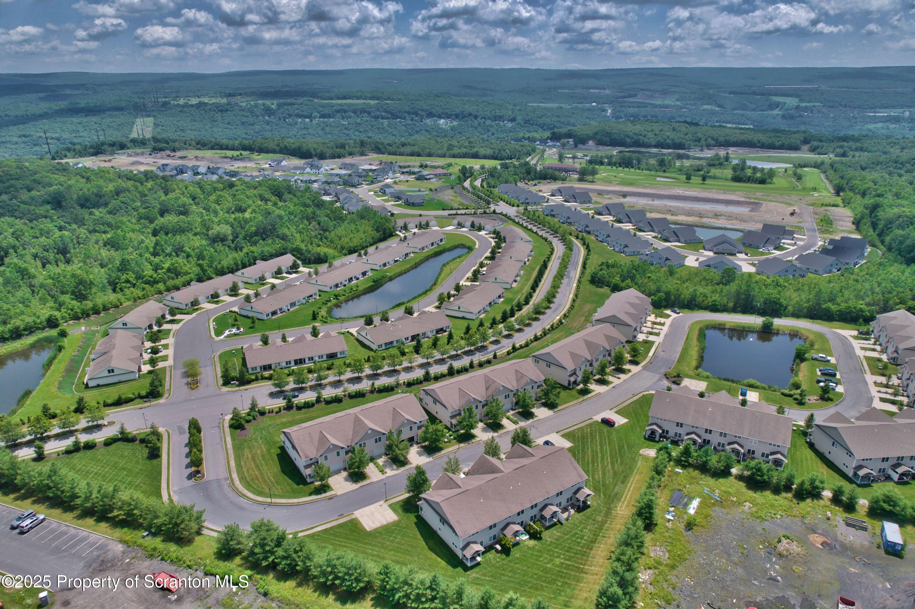 233 Shadow Wood Circle Archbald, PA 18403 - Photo 57 of 62 an aerial view of a house with a garden
