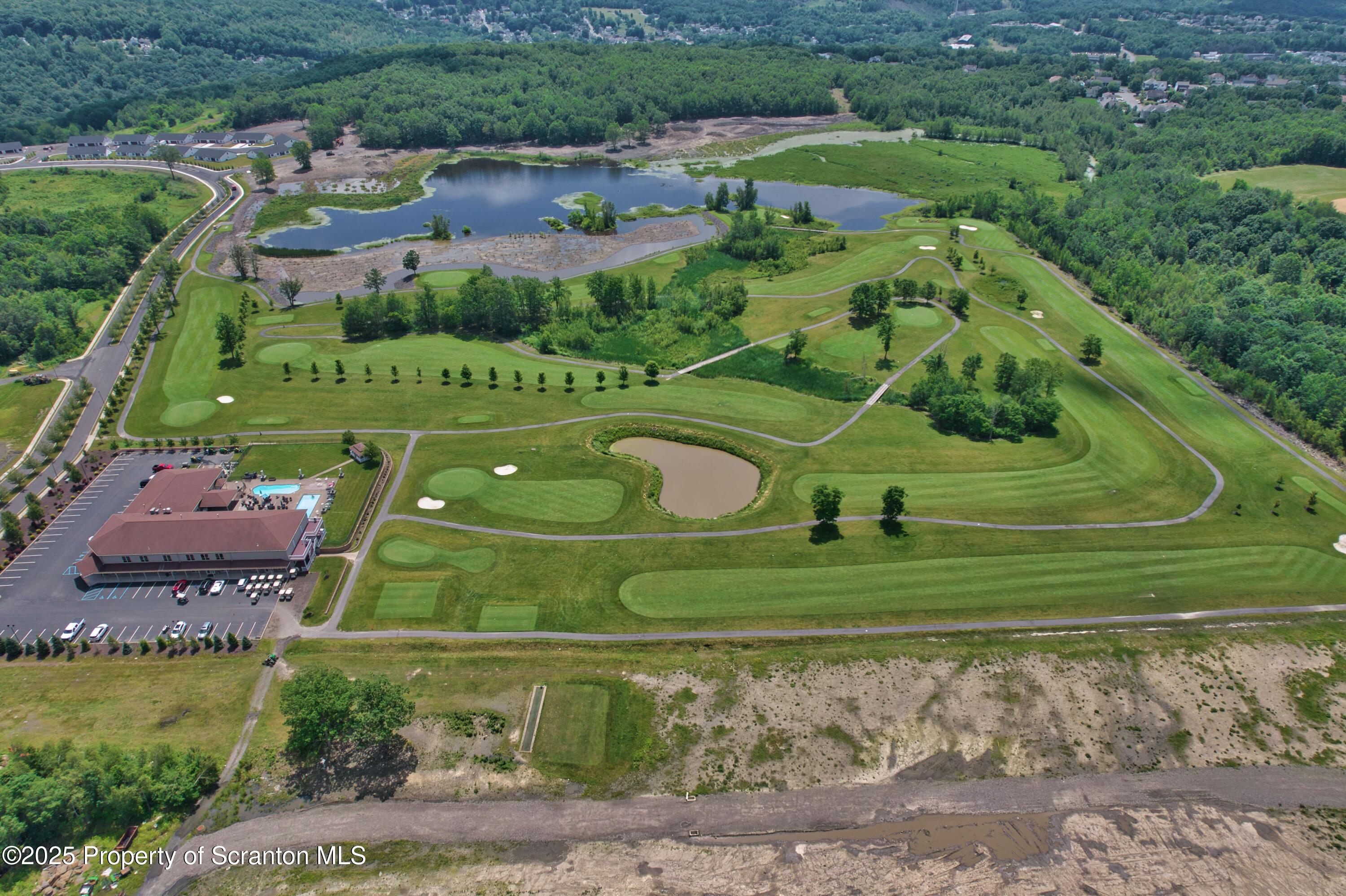 233 Shadow Wood Circle Archbald, PA 18403 - Photo 58 of 62 an aerial view of a golf course with a garden