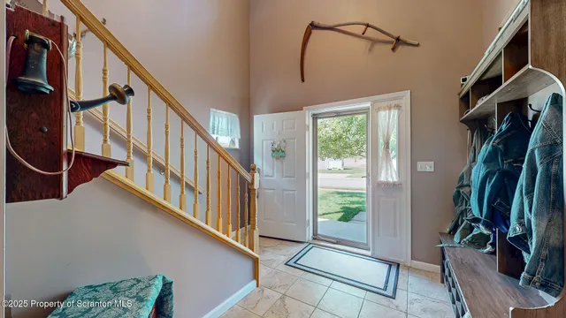 a kitchen with stainless steel appliances kitchen island granite countertop a refrigerator and a stove top oven