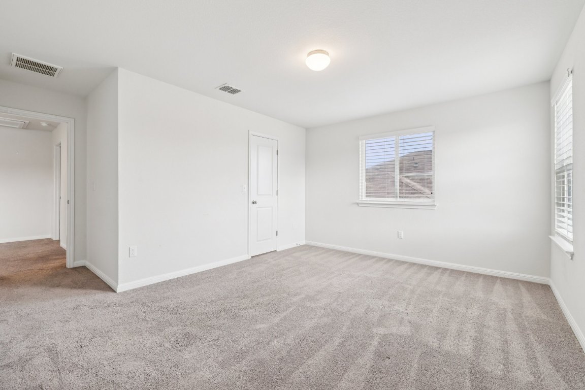 10712 Blacket Drive Austin, TX 78747 - Photo 26 of 40 an empty room with windows