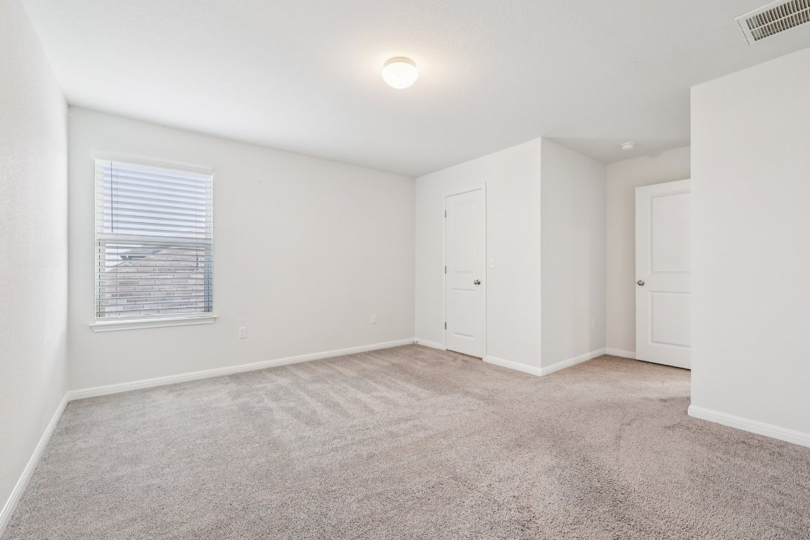 10712 Blacket Drive Austin, TX 78747 - Photo 29 of 40 an empty room with windows