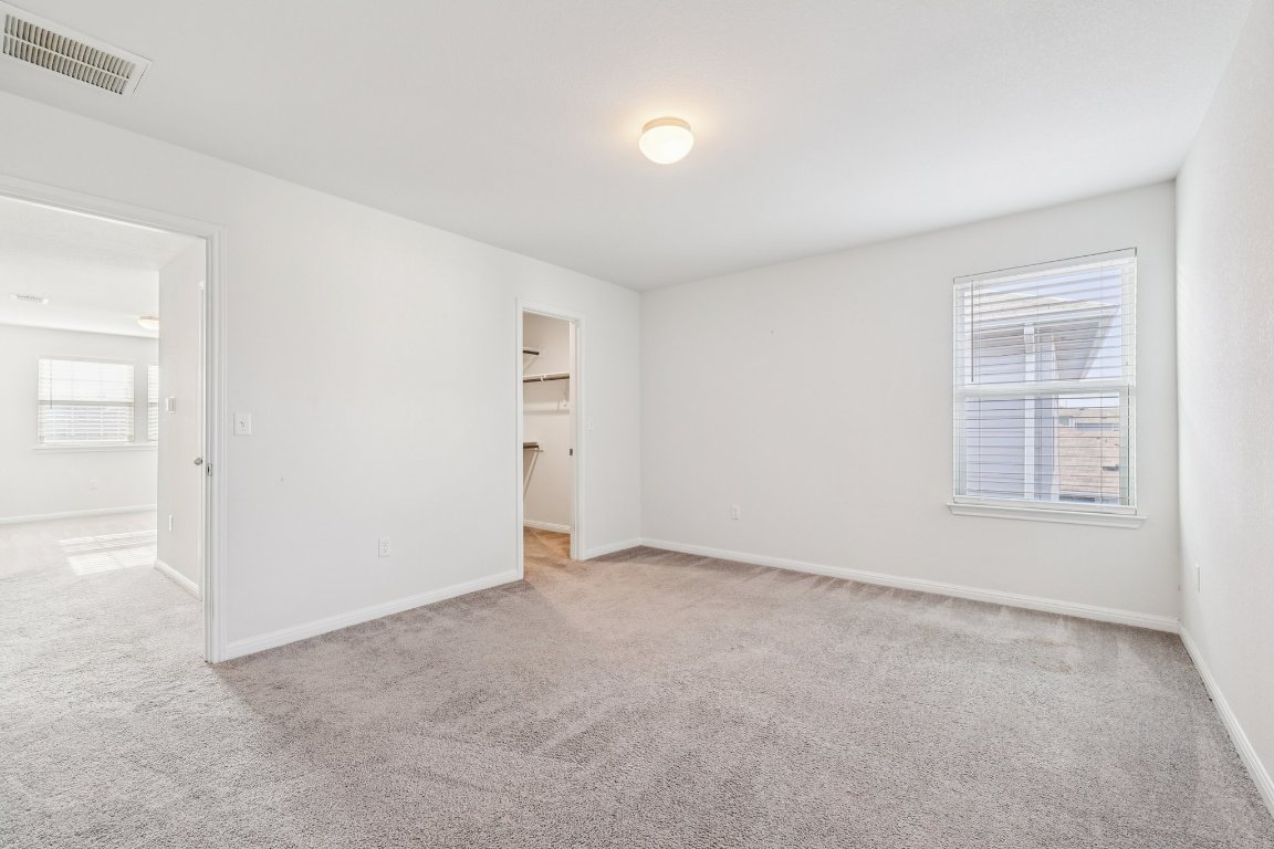 10712 Blacket Drive Austin, TX 78747 - Photo 31 of 40 an empty room with windows
