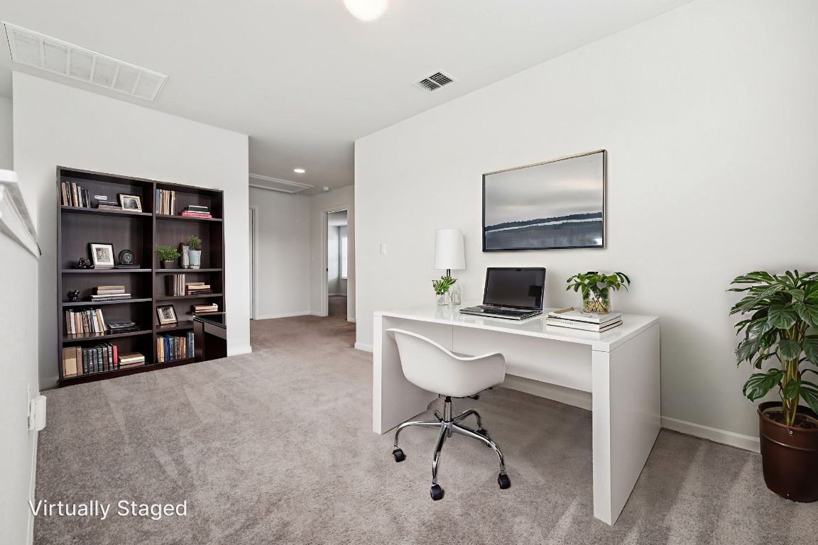 10712 Blacket Drive Austin, TX 78747 - Photo 32 of 40 a workspace with furniture and window