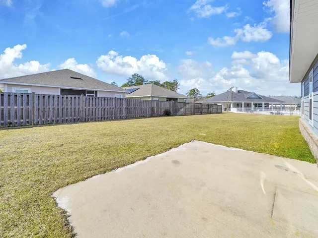 a front view of a house with yard