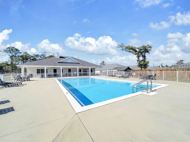 a view of house with outdoor space and seating area