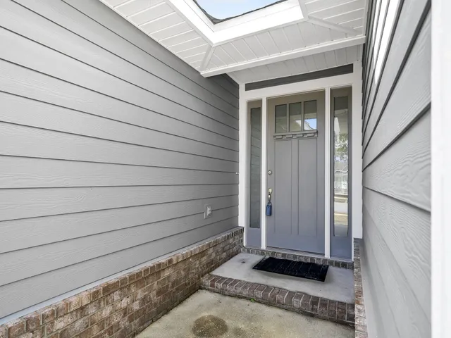 a view of front door and a window