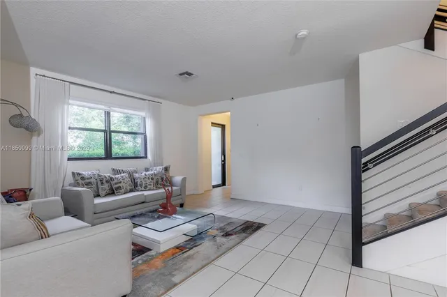 a view of a hallway with seating area