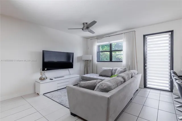 a kitchen with stainless steel appliances a sink a stove a microwave a sink a refrigerator and cabinets