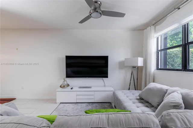 a kitchen with a center island and cabinets