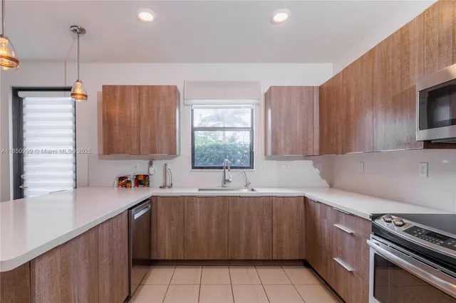 a bedroom with a bed and a flat screen tv in white walls