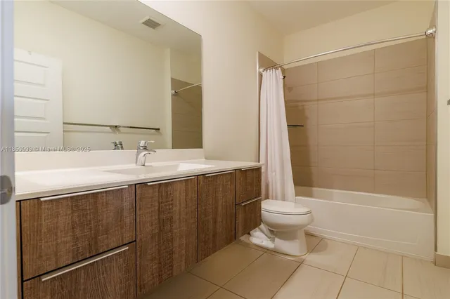 a bedroom with a bed and cabinet