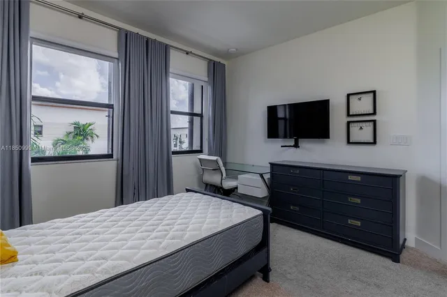 a bedroom with a bed and a fireplace