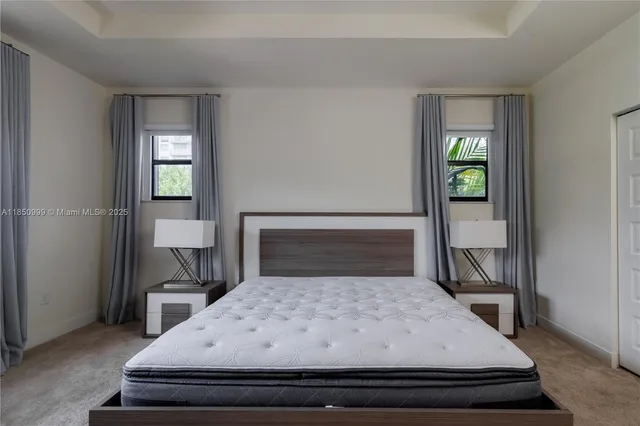 a bathroom with a double vanity sink a mirror and a