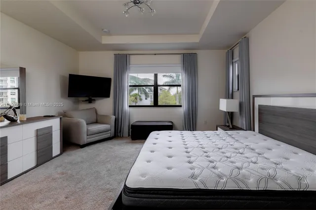 a view of an empty room and a bathroom