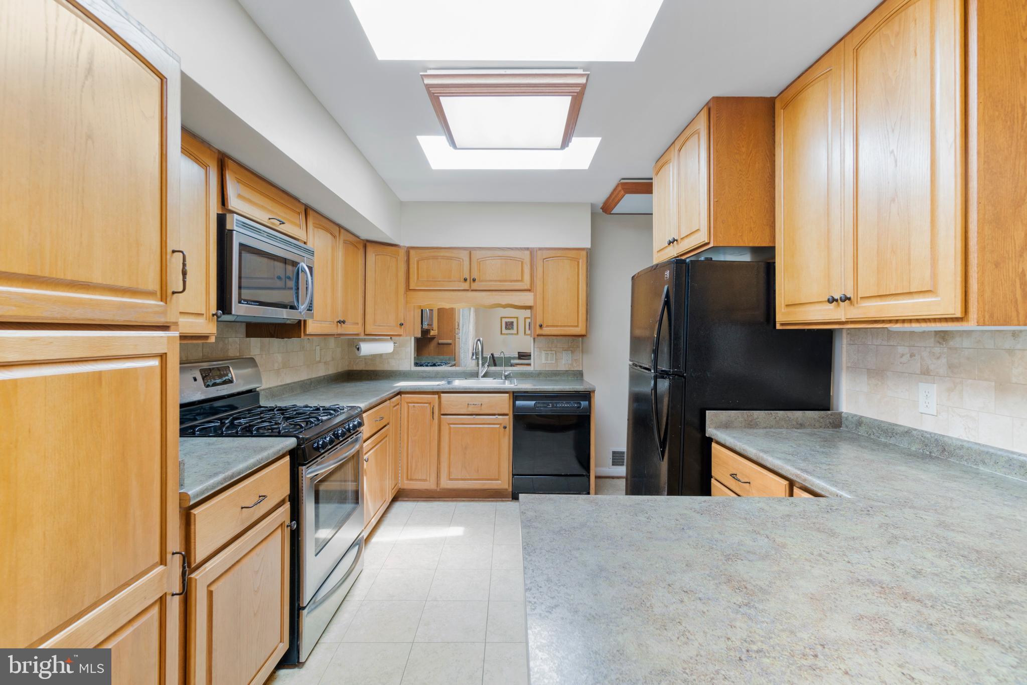 215 Hutton Street Gaithersburg, MD 20877 - Photo 5 of 36 Beautiful skylights in the kitchen