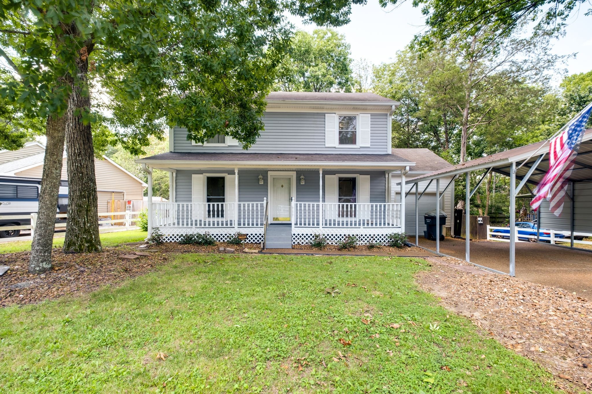 front view of a house with a yard