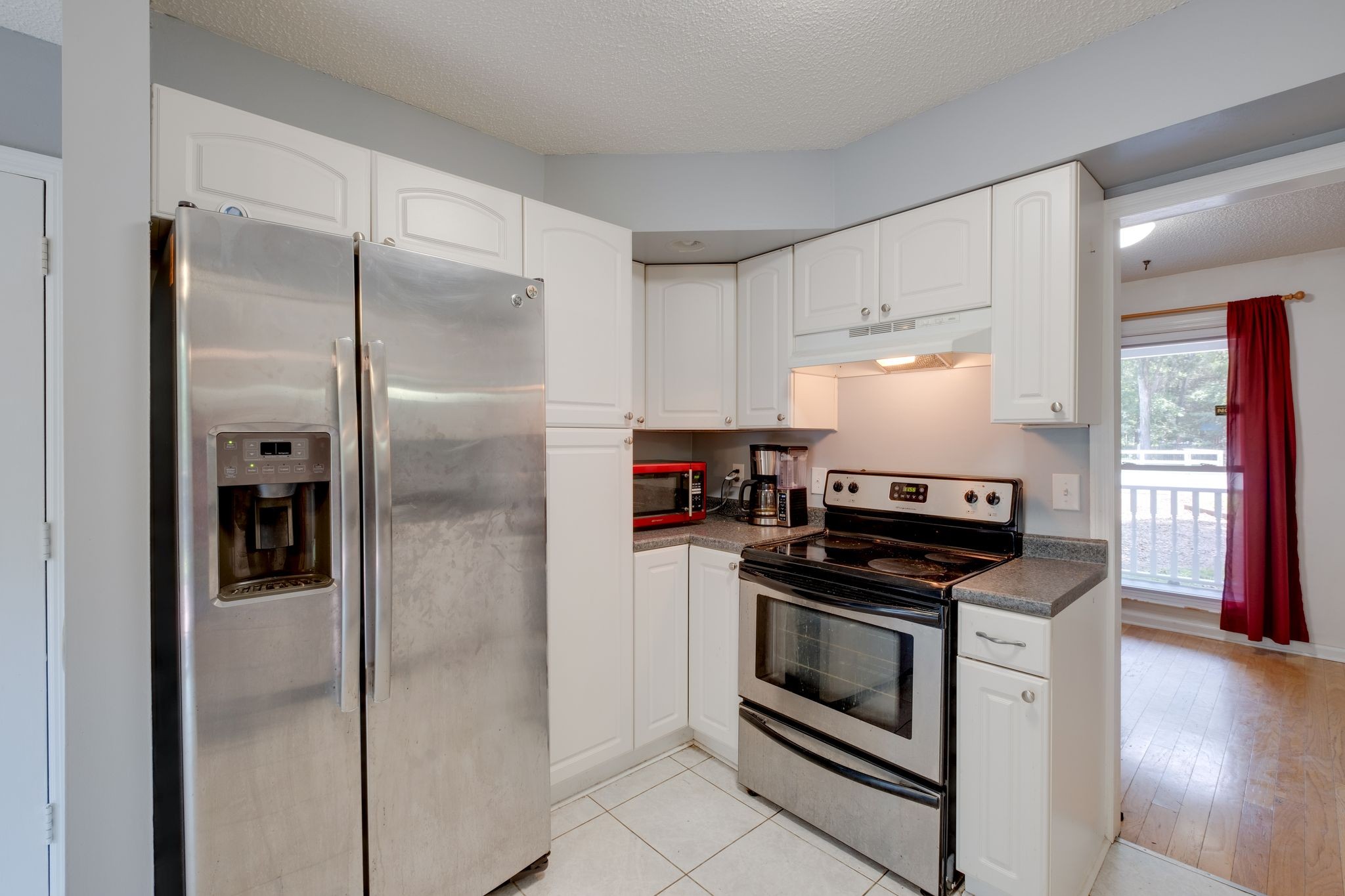 2445 Nonaville Road Mount Juliet, TN 37122 - Photo 15 of 29 a kitchen with white cabinets and stainless steel appliances