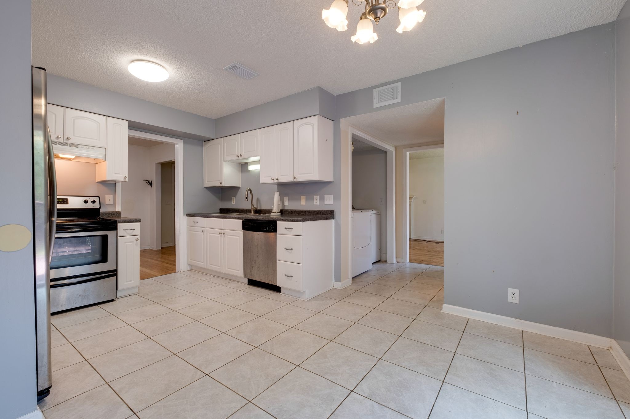 2445 Nonaville Road Mount Juliet, TN 37122 - Photo 16 of 29 a kitchen with stainless steel appliances a refrigerator sink and cabinets