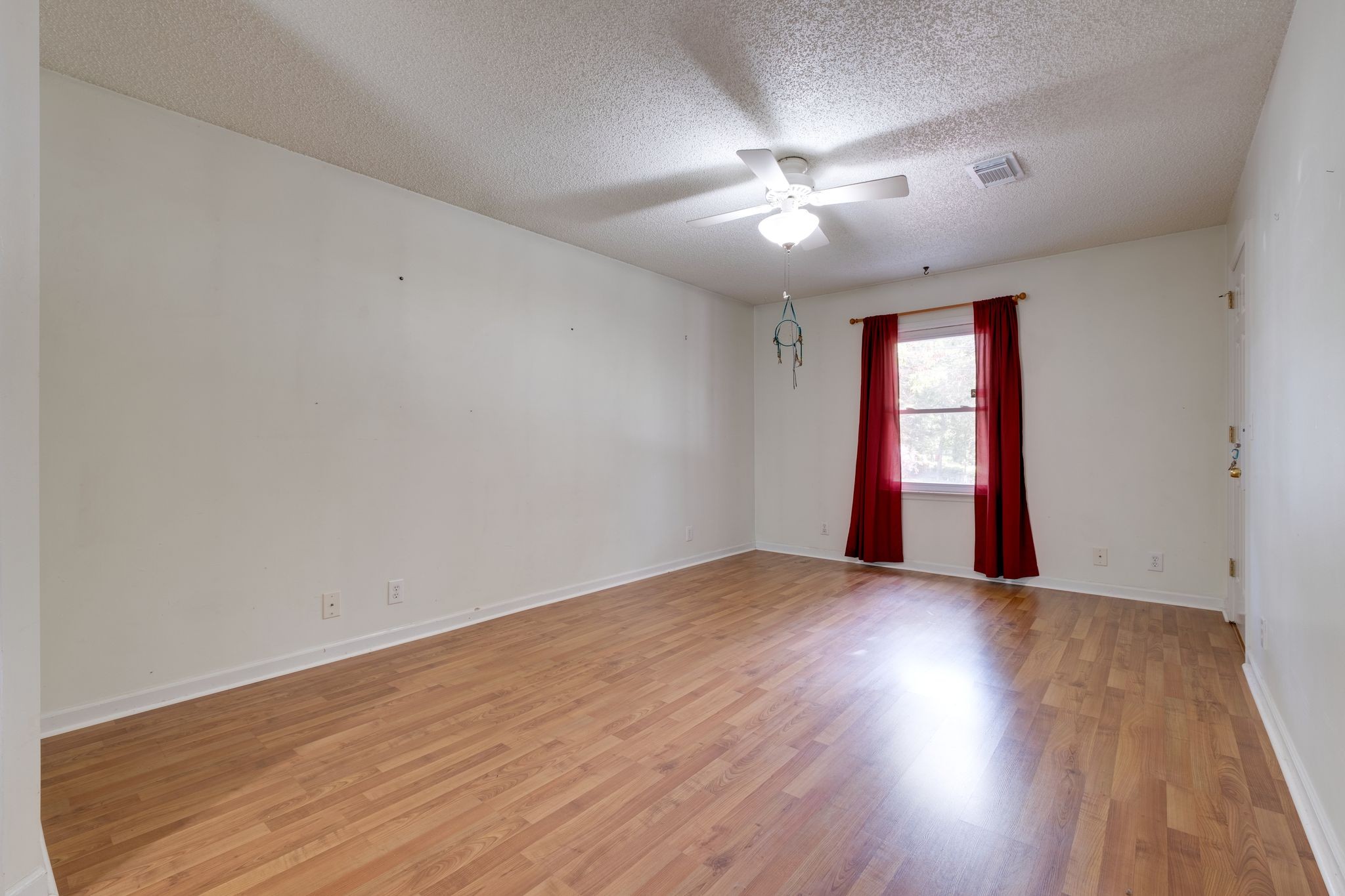 2445 Nonaville Road Mount Juliet, TN 37122 - Photo 19 of 29 an empty room with wooden floor and windows