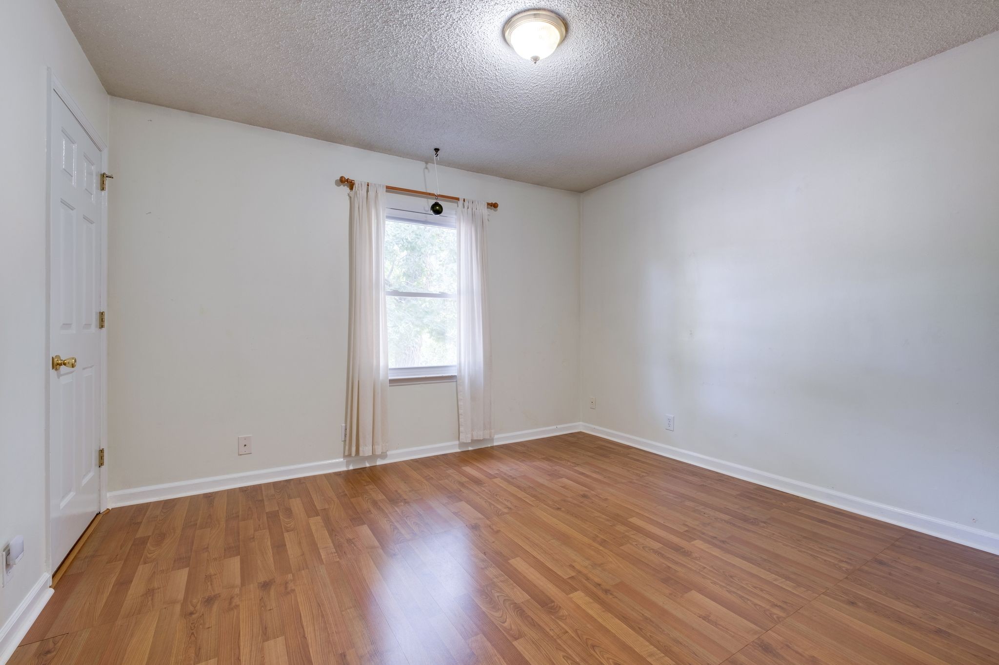 2445 Nonaville Road Mount Juliet, TN 37122 - Photo 22 of 29 an empty room with wooden floor and windows