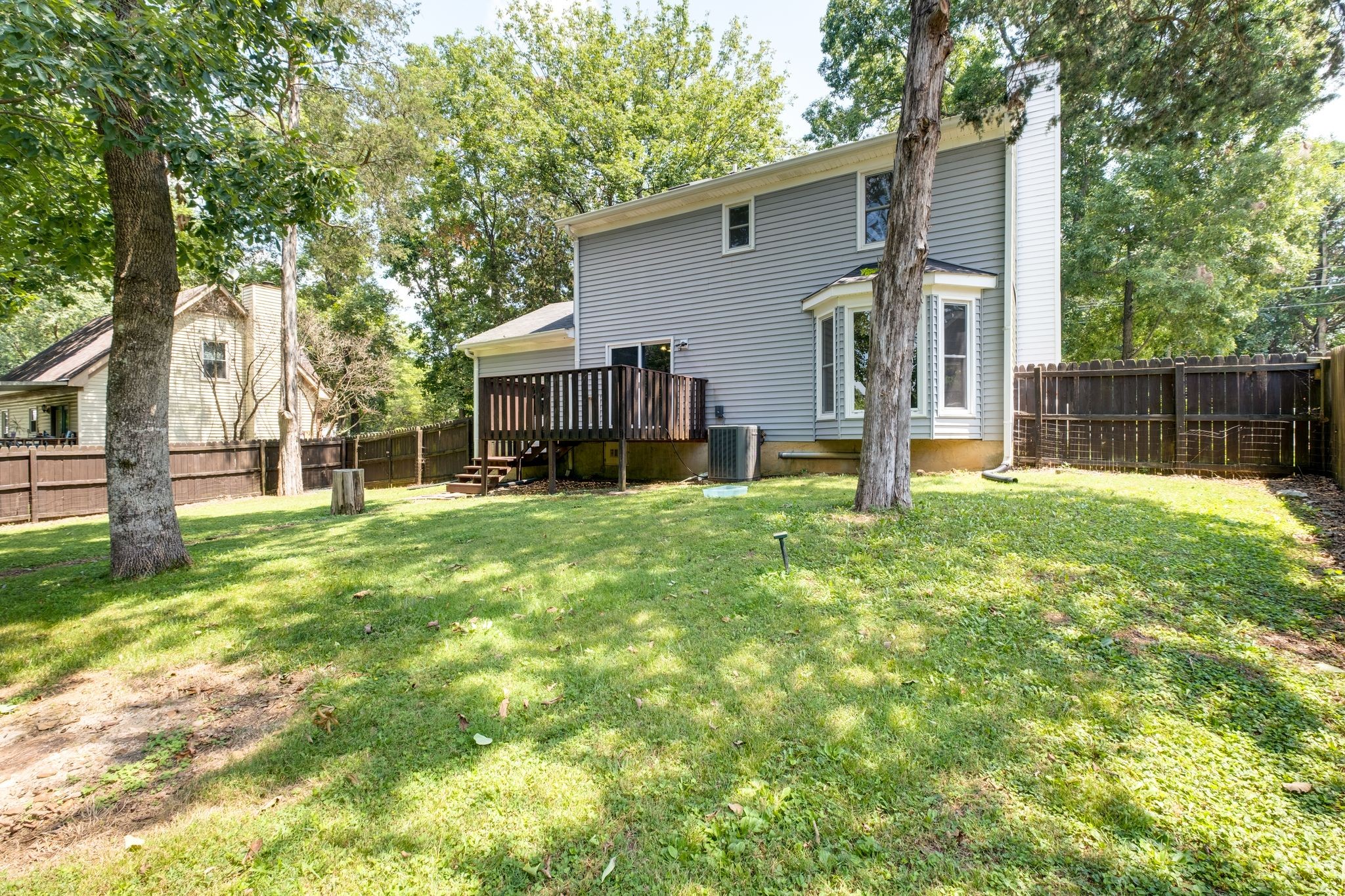 2445 Nonaville Road Mount Juliet, TN 37122 - Photo 29 of 29 a view of a house with a big yard and a large tree