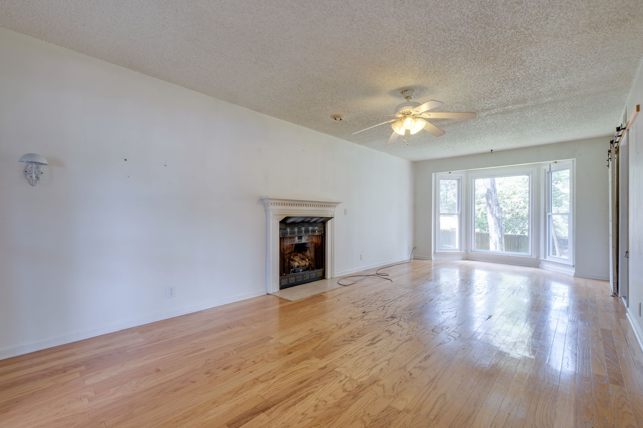2445 Nonaville Road Mount Juliet, TN 37122 - Photo 9 of 29 wooden floor in an empty room with a window