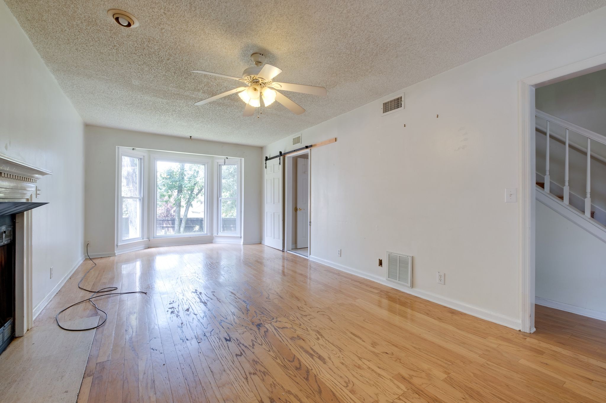 2445 Nonaville Road Mount Juliet, TN 37122 - Photo 10 of 29 a view of empty room with wooden floor and fan