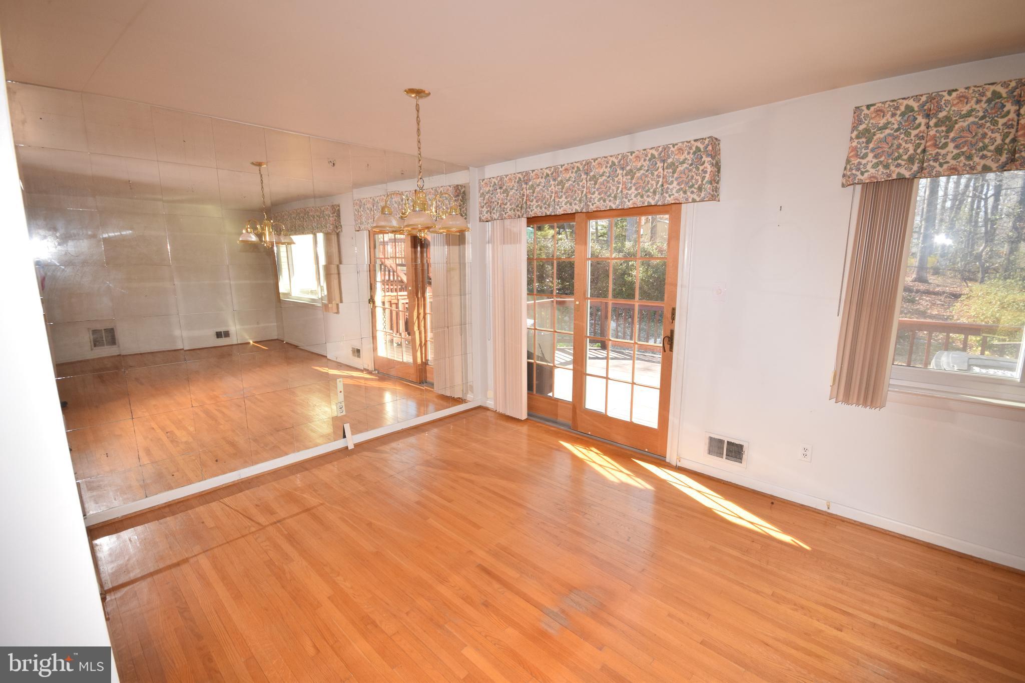7004 Redmiles Road Laurel, MD 20707 - Photo 12 of 35 Living and dining rooms with hardwood flooring