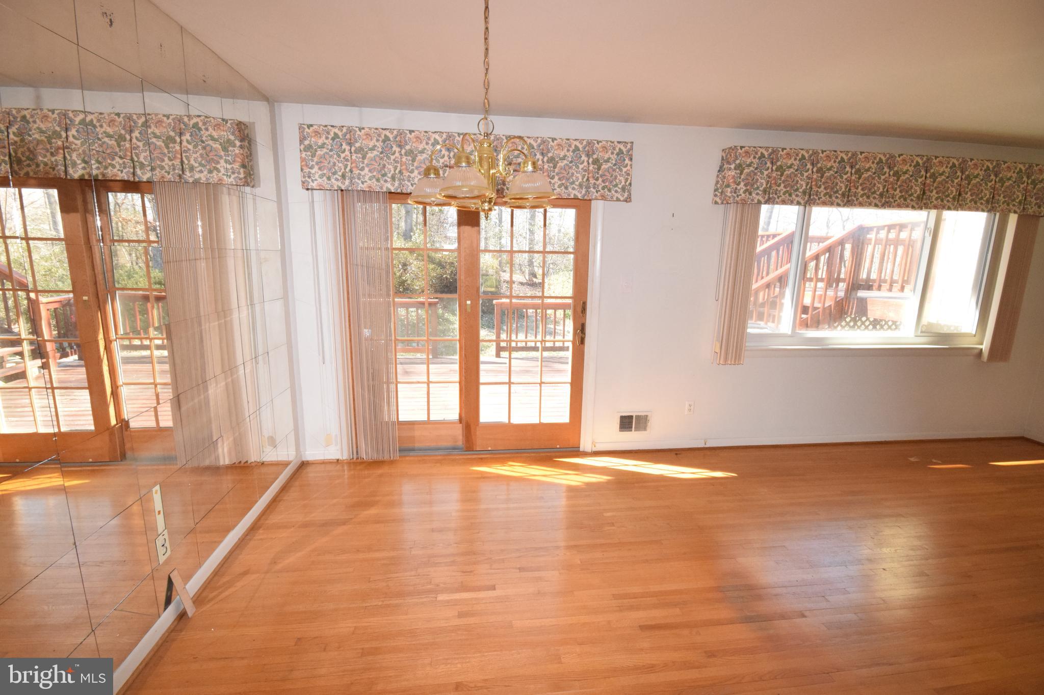 7004 Redmiles Road Laurel, MD 20707 - Photo 13 of 35 Sliders from the dining room to the 2 level deck