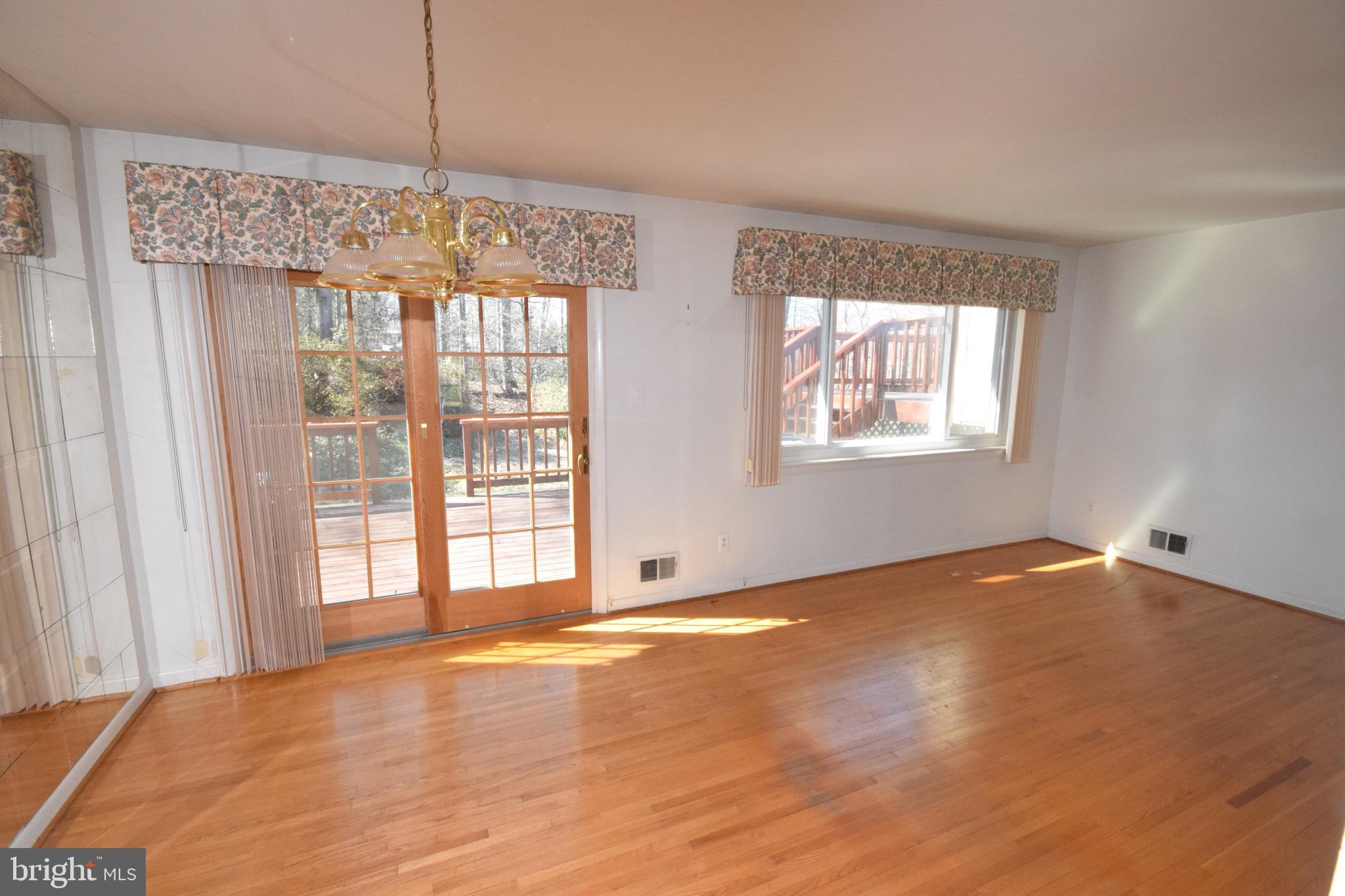 7004 Redmiles Road Laurel, MD 20707 - Photo 15 of 35 Sliders from the dining room to the 2 level deck