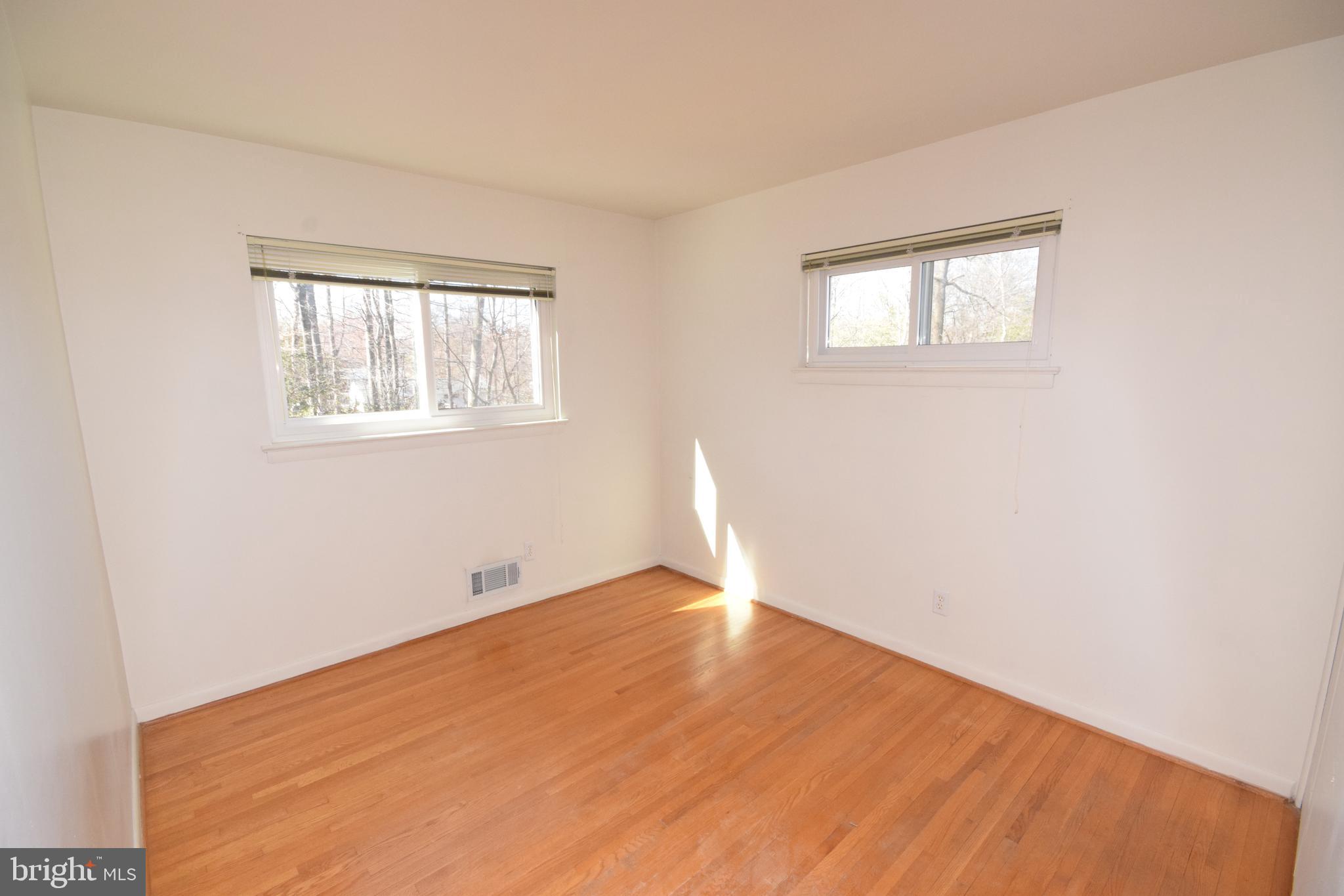 7004 Redmiles Road Laurel, MD 20707 - Photo 21 of 35 Bedroom 4 with hardwood floors