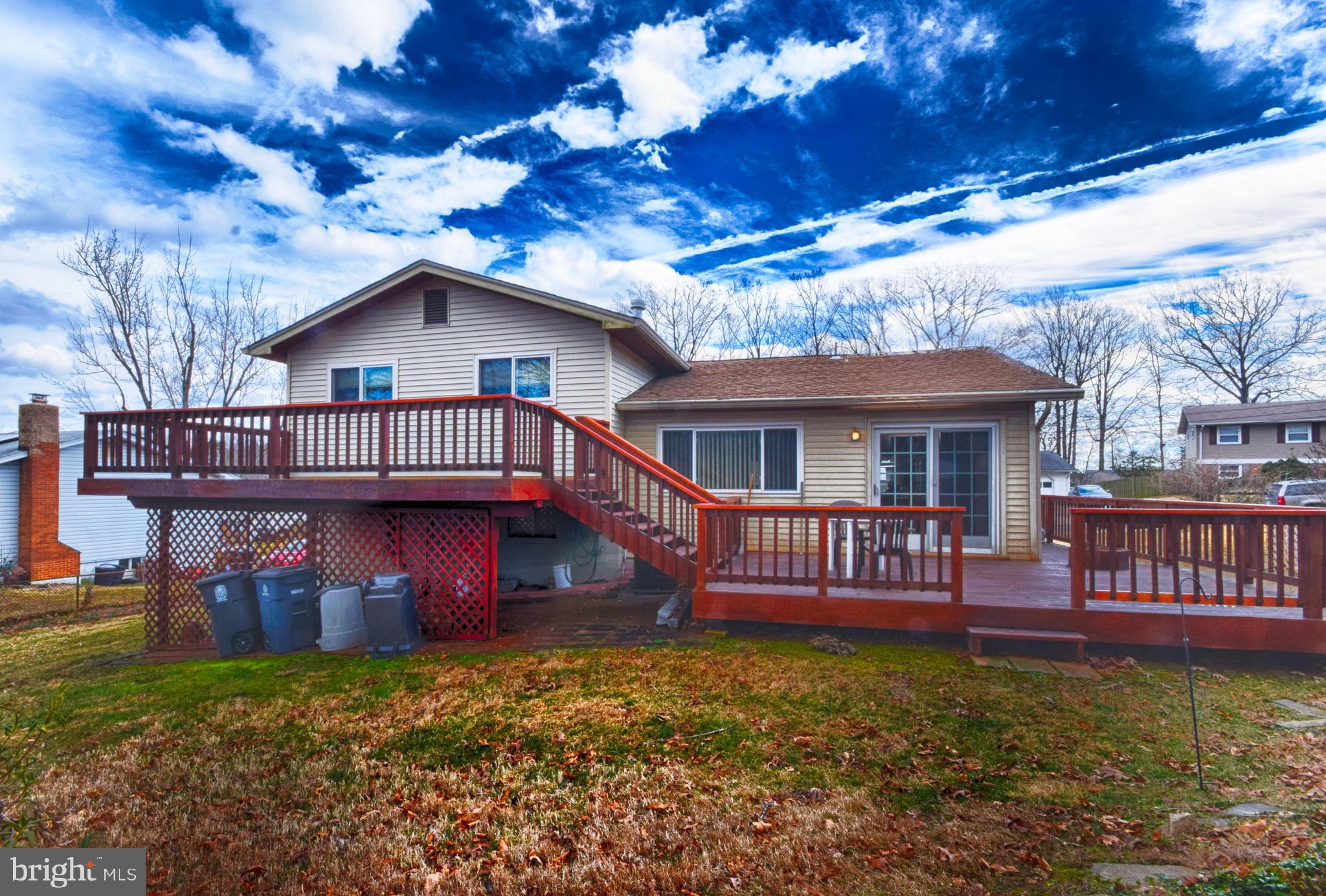 7004 Redmiles Road Laurel, MD 20707 - Photo 4 of 35 Huge 2 level deck overlooks private rear yard