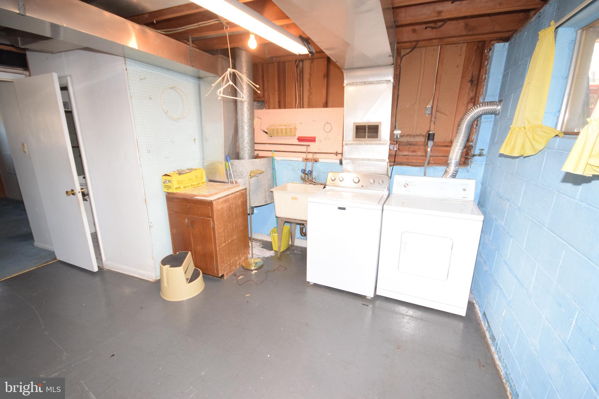 7004 Redmiles Road Laurel, MD 20707 - Photo 34 of 35 Laundry room, washer/dryer, door to backyard