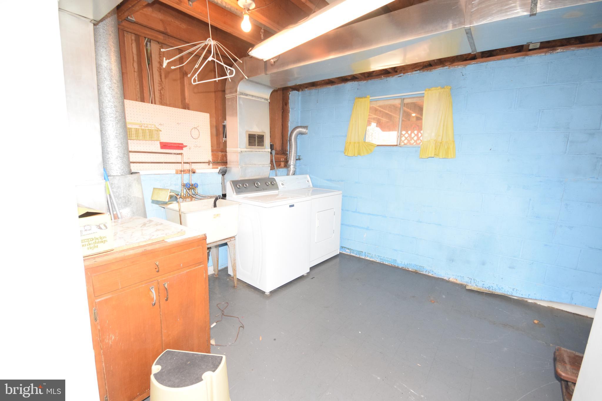 7004 Redmiles Road Laurel, MD 20707 - Photo 35 of 35 Laundry room, washer/dryer, door to backyard