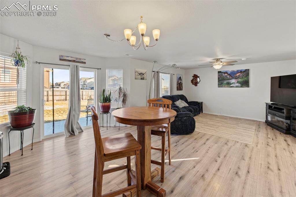 8151 Berwyn Loop Peyton, CO 80831 - Photo 12 of 39 a view of a dining room with furniture and wooden floor