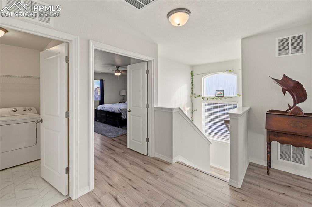 8151 Berwyn Loop Peyton, CO 80831 - Photo 17 of 39 a view of a hallway to a livingroom and a hallway