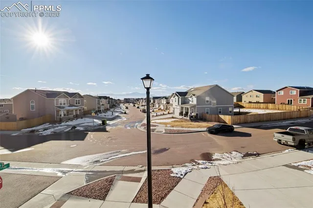 a outdoor space with lots of cars parked