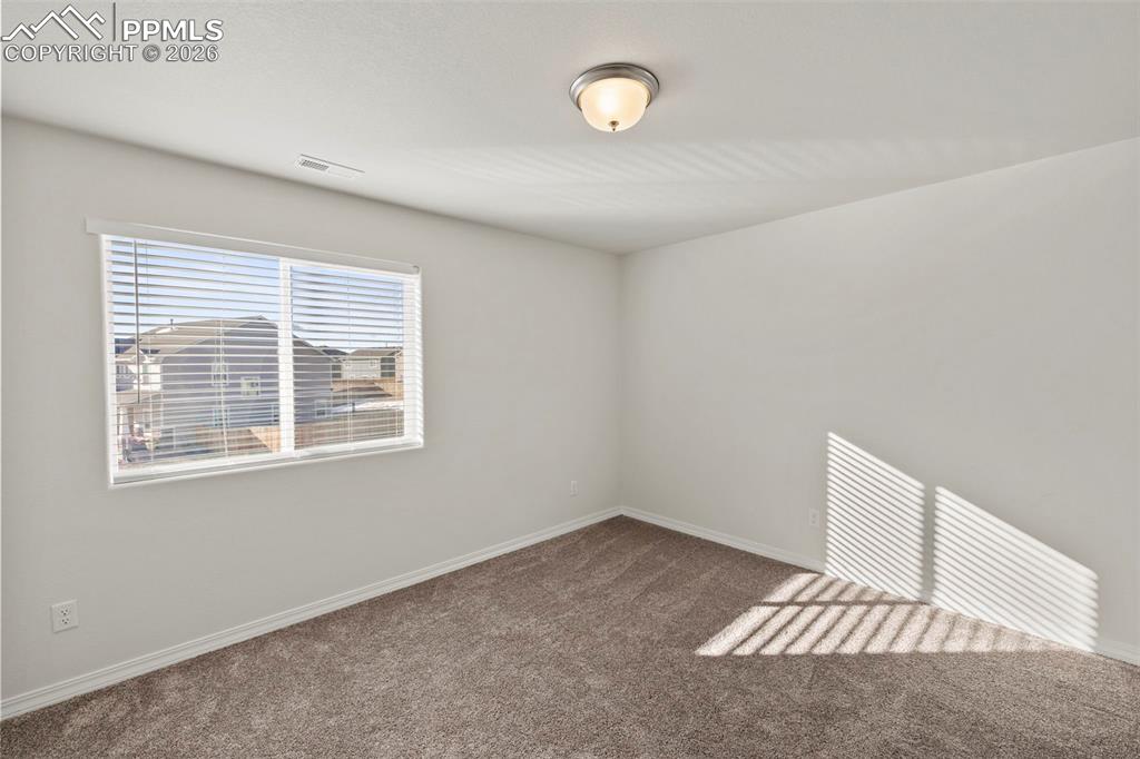8151 Berwyn Loop Peyton, CO 80831 - Photo 26 of 39 an empty room with a window