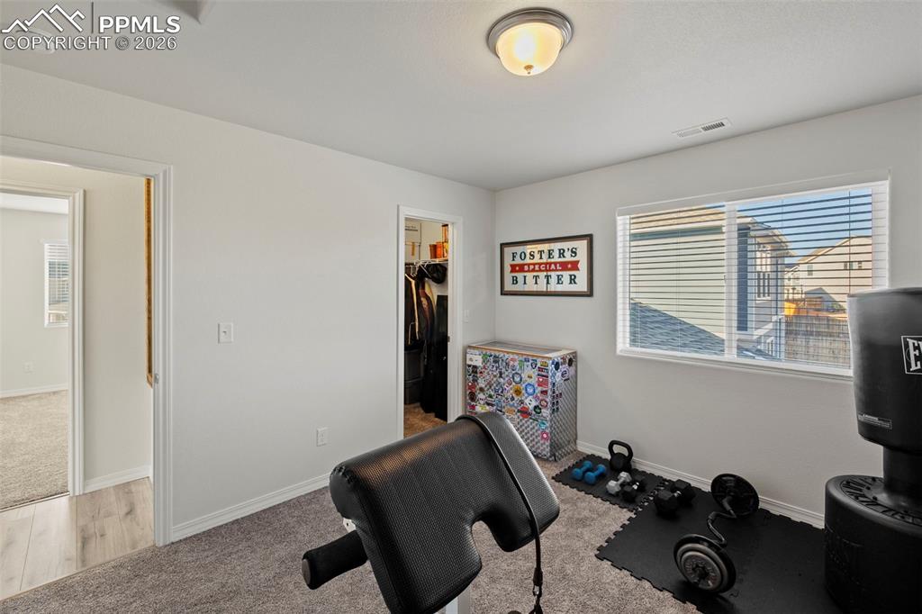 8151 Berwyn Loop Peyton, CO 80831 - Photo 27 of 39 a view of a workspace with furniture and a window