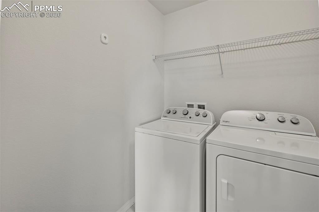 8151 Berwyn Loop Peyton, CO 80831 - Photo 30 of 39 a utility room with dryer and washer