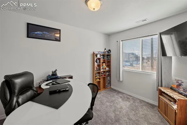 a room with furniture and a window